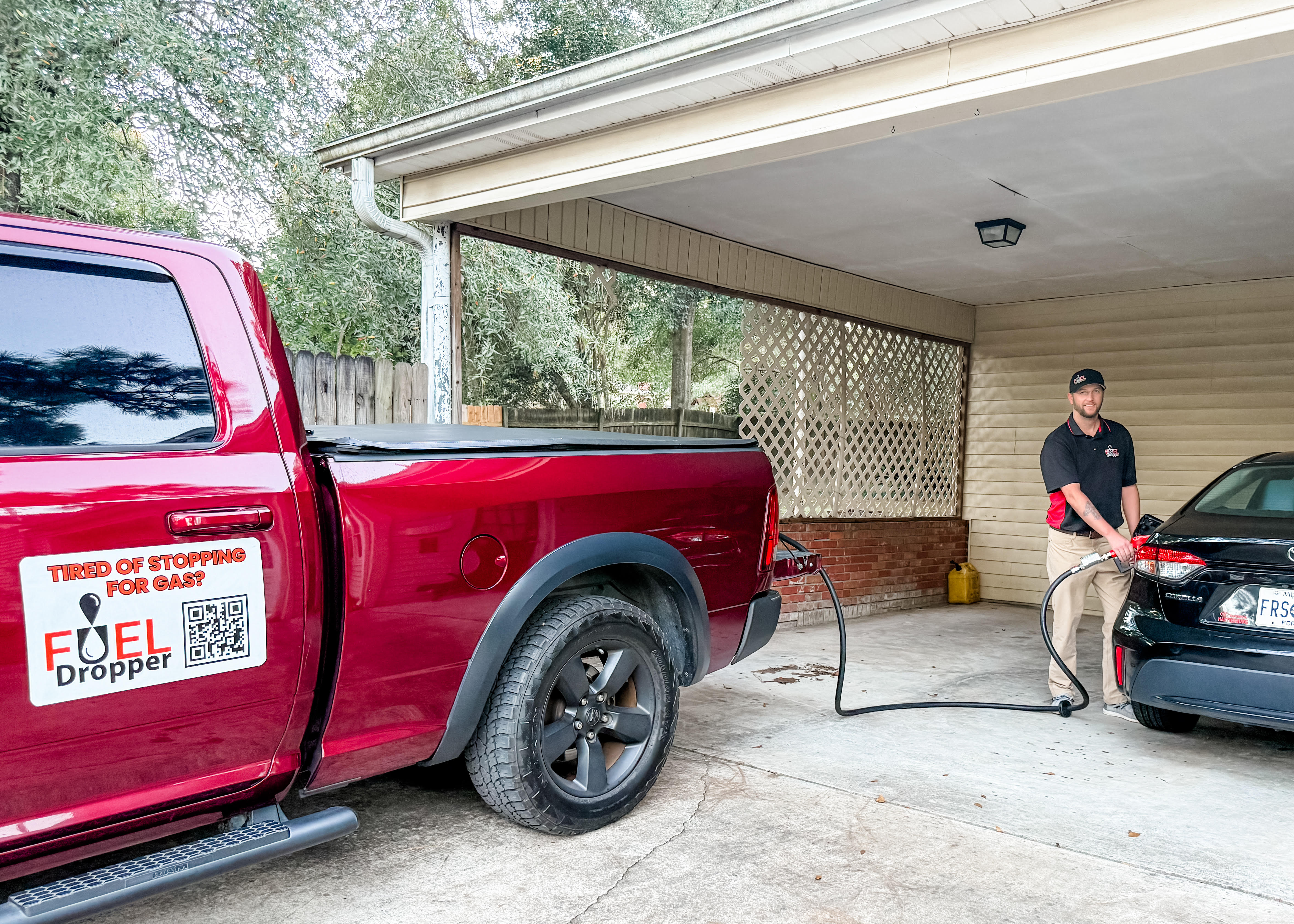 FuelDropper professional delivering fuel to a customer's vehicle at their home
